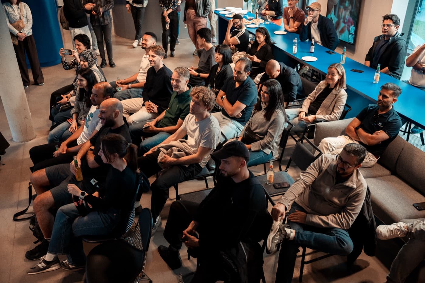 Ampli community watching a talk at a Berlin meetup